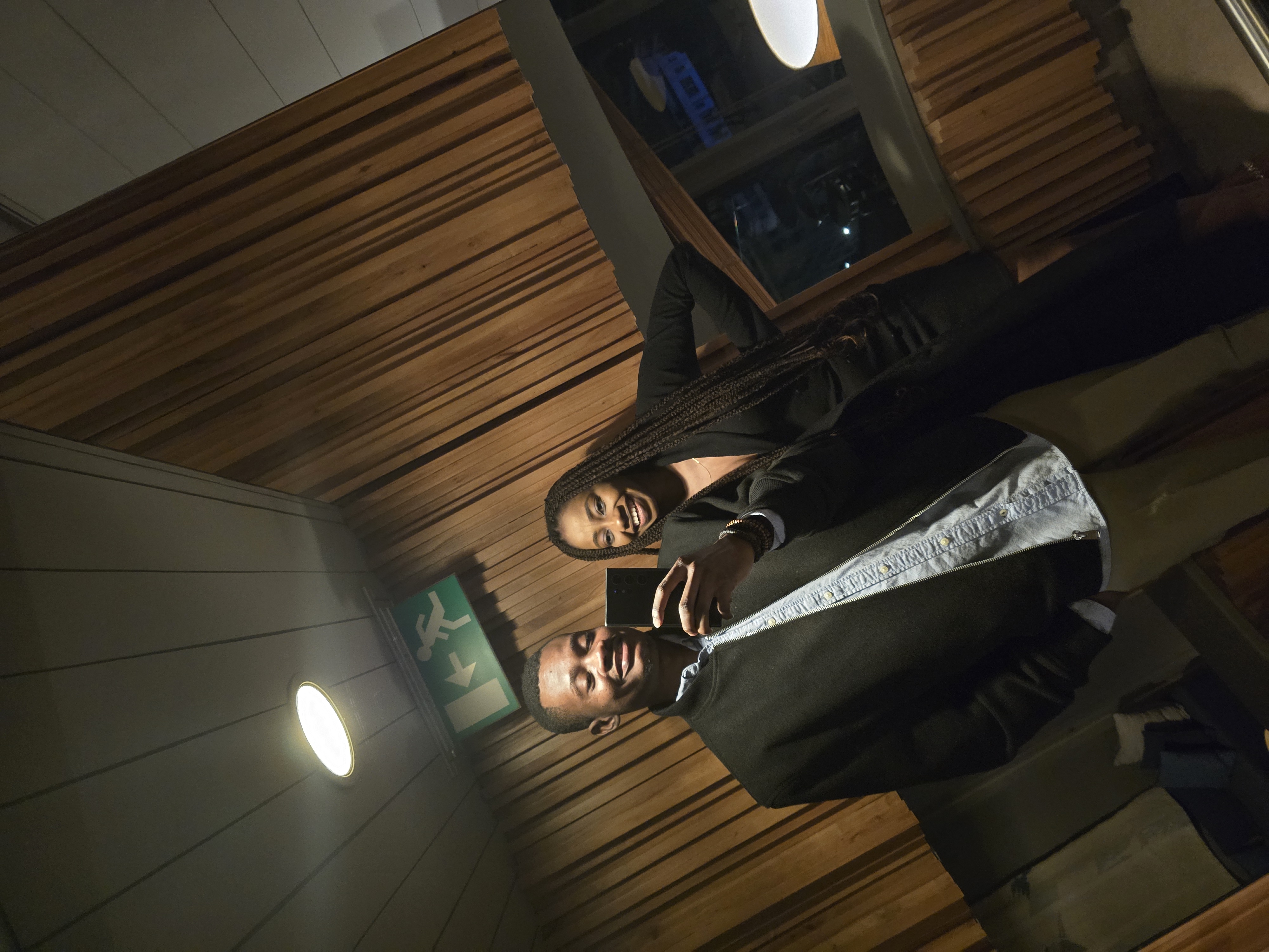 Oluwasefunmi and Olanrewaju smiling in a mirror selfie
