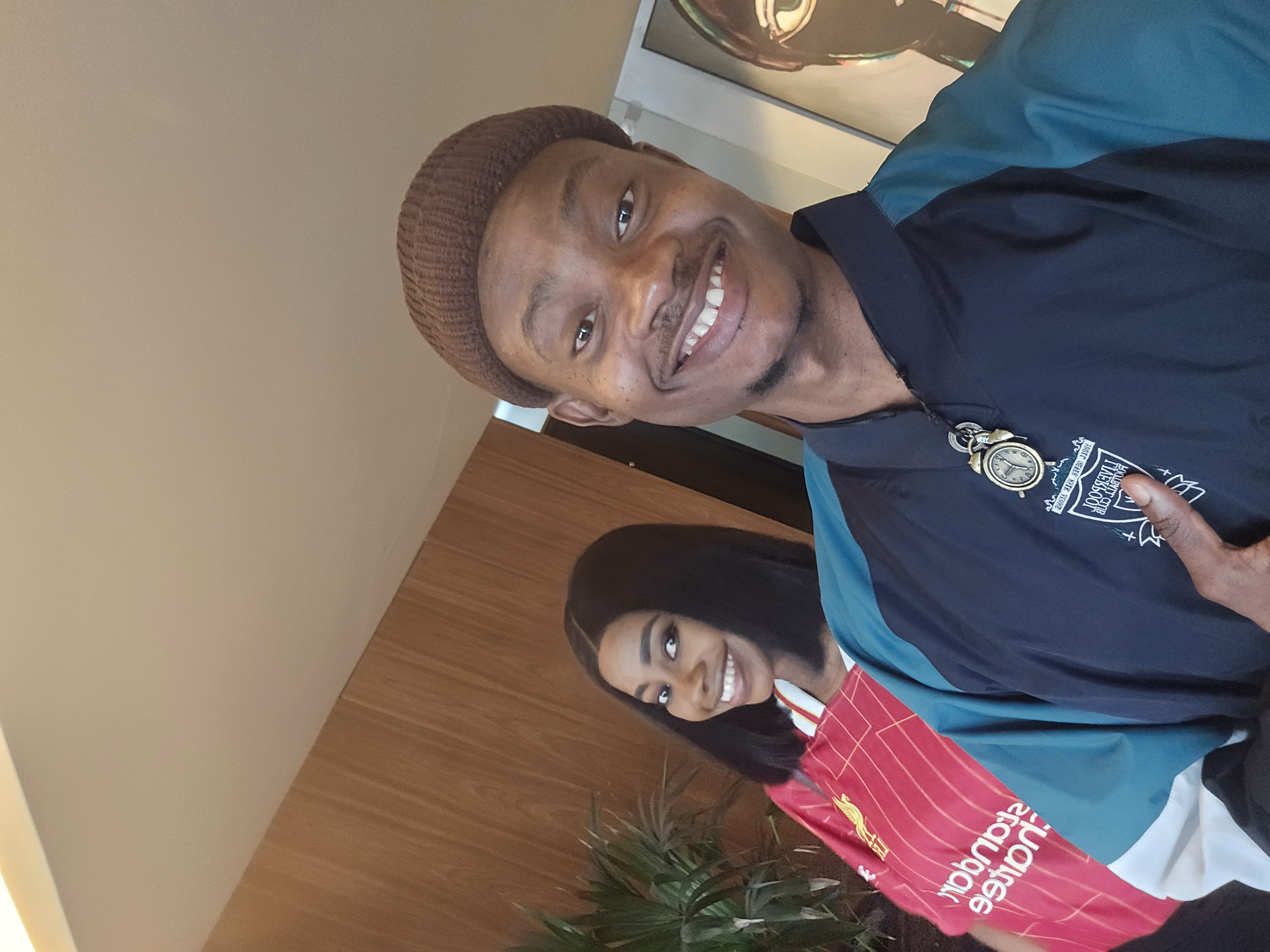 Oluwasefunmi and Olanrewaju smiling in football jerseys