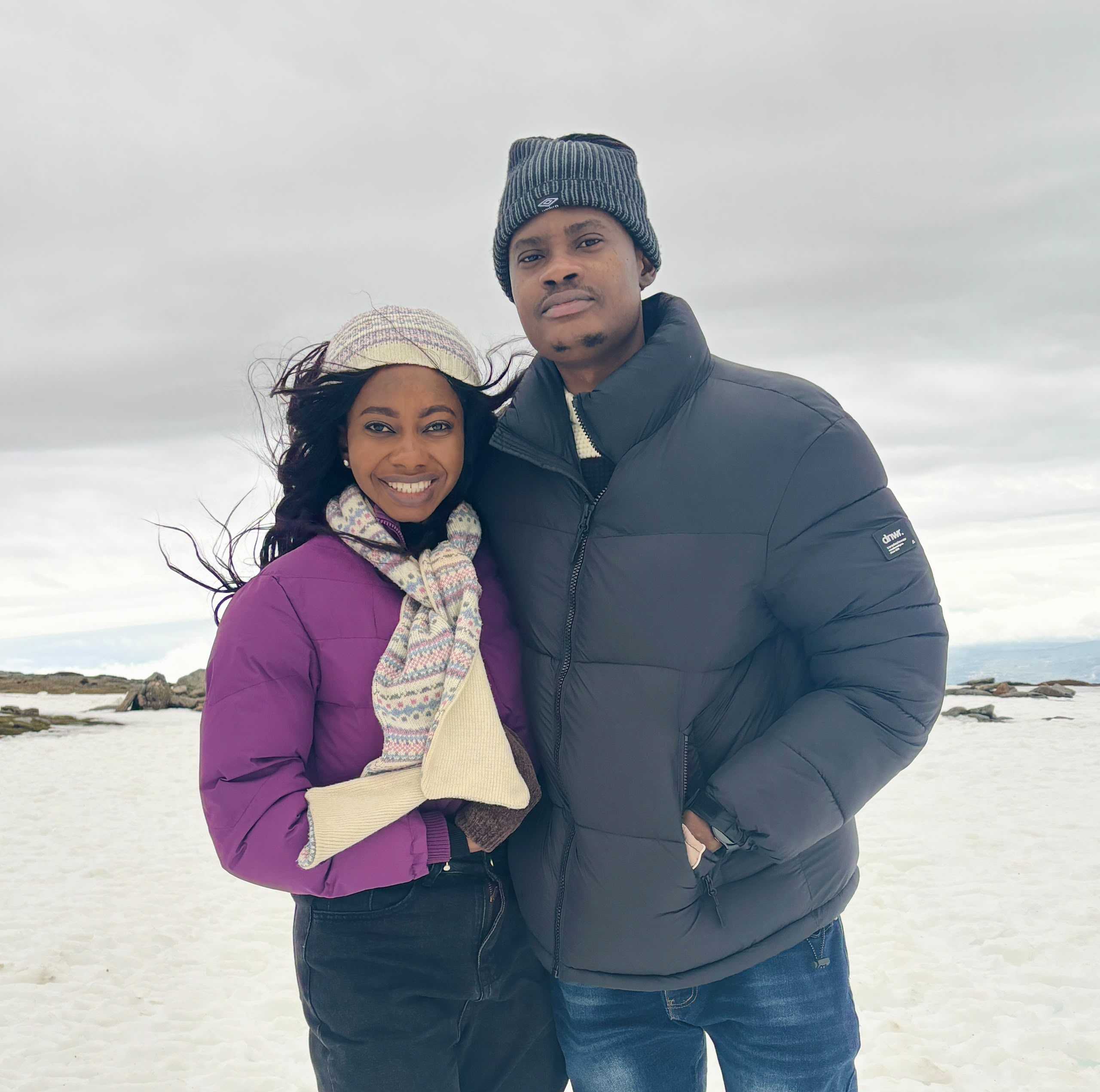 Oluwasefunmi and Olanrewaju standing together in the snow