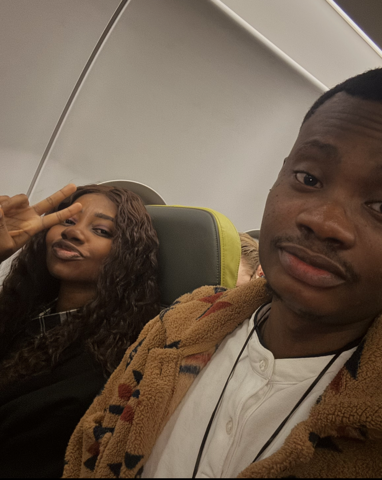 Oluwasefunmi and Olanrewaju taking a plane selfie
