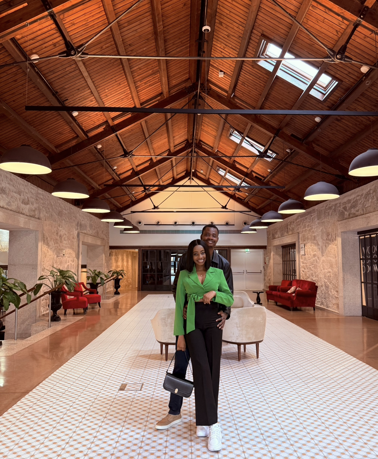 Oluwasefunmi and Olanrewaju in a warm hall