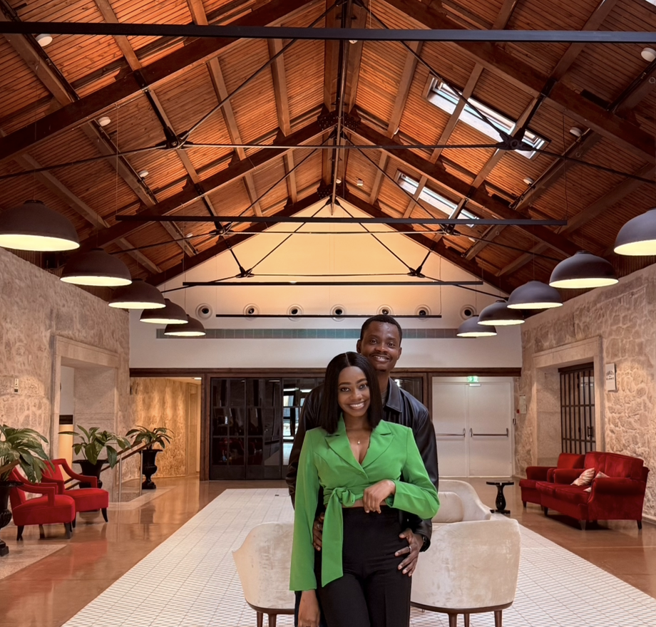 Oluwasefunmi and Olanrewaju standing together in a warm hall